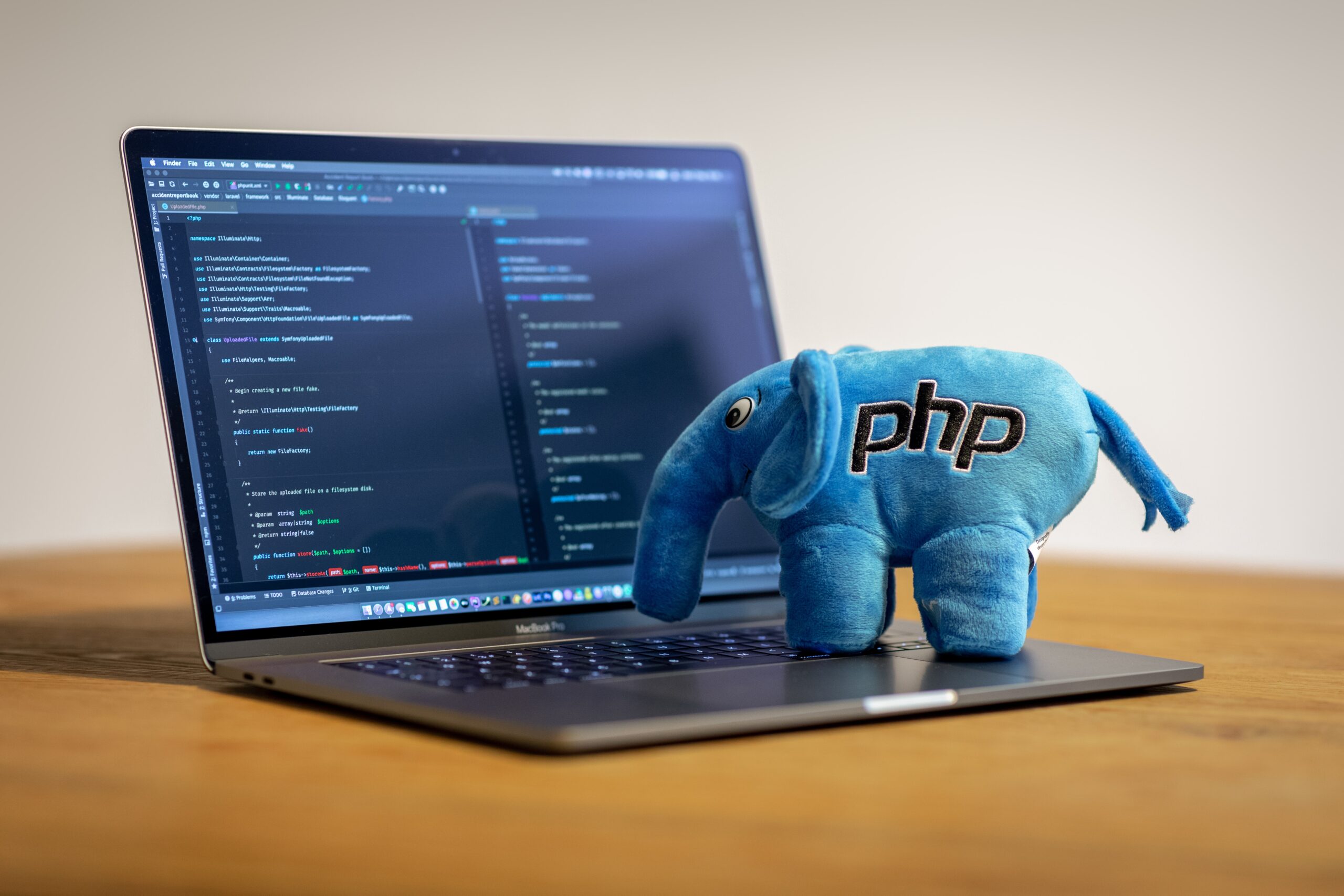 PHP Plush Elephant on a Macbook Pro, with PHP Storm running on it.