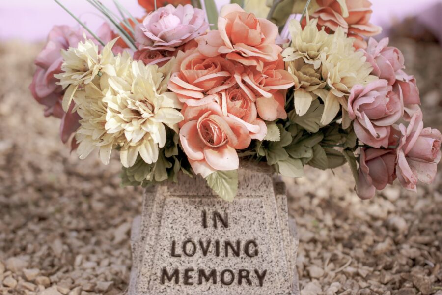 Faded flowers on a grave